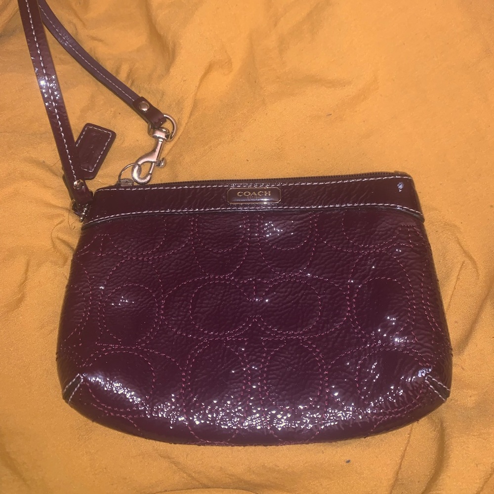 Plum purple Coach Wristlet